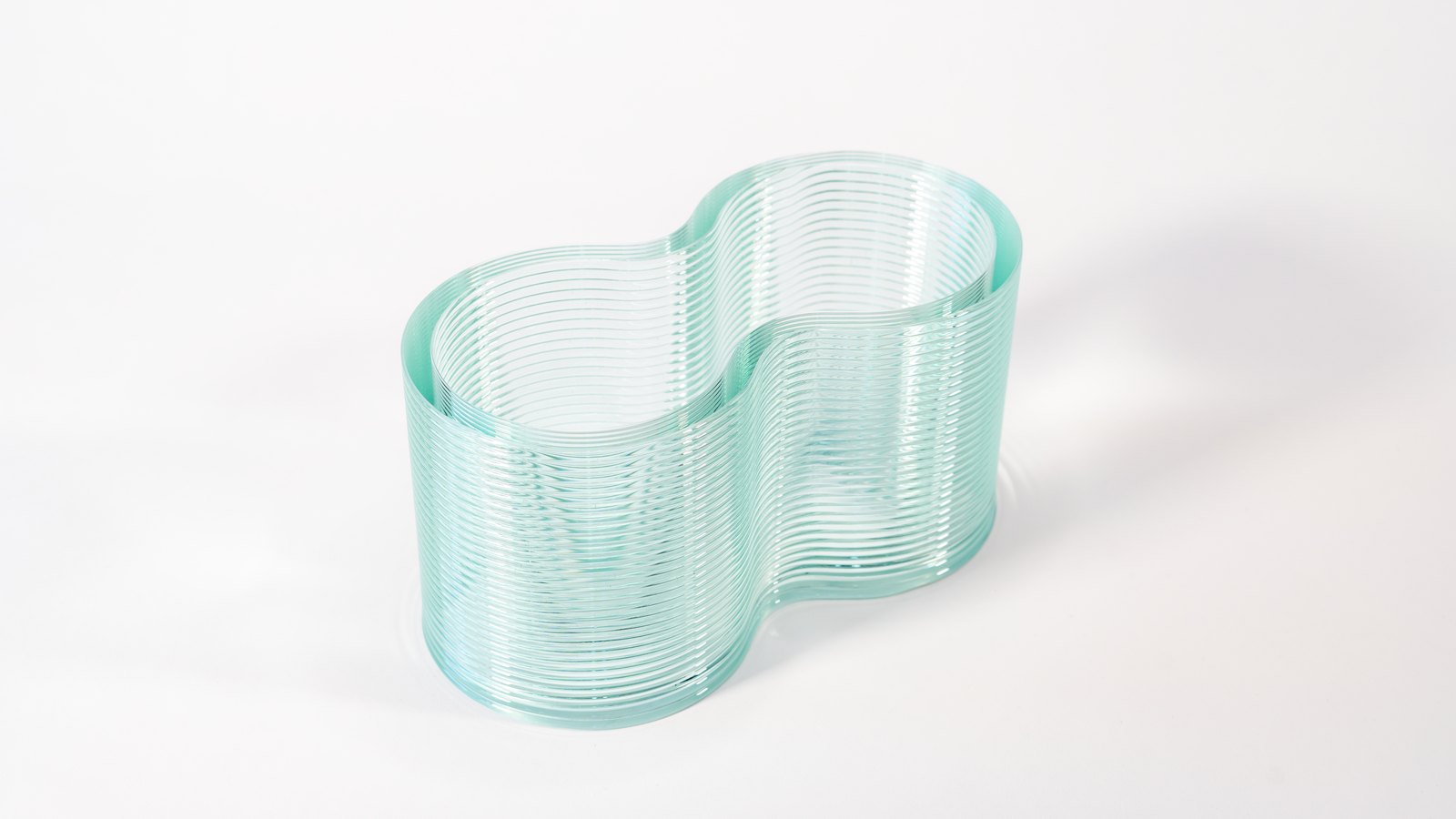 A single interlocking glass masonry unit on white