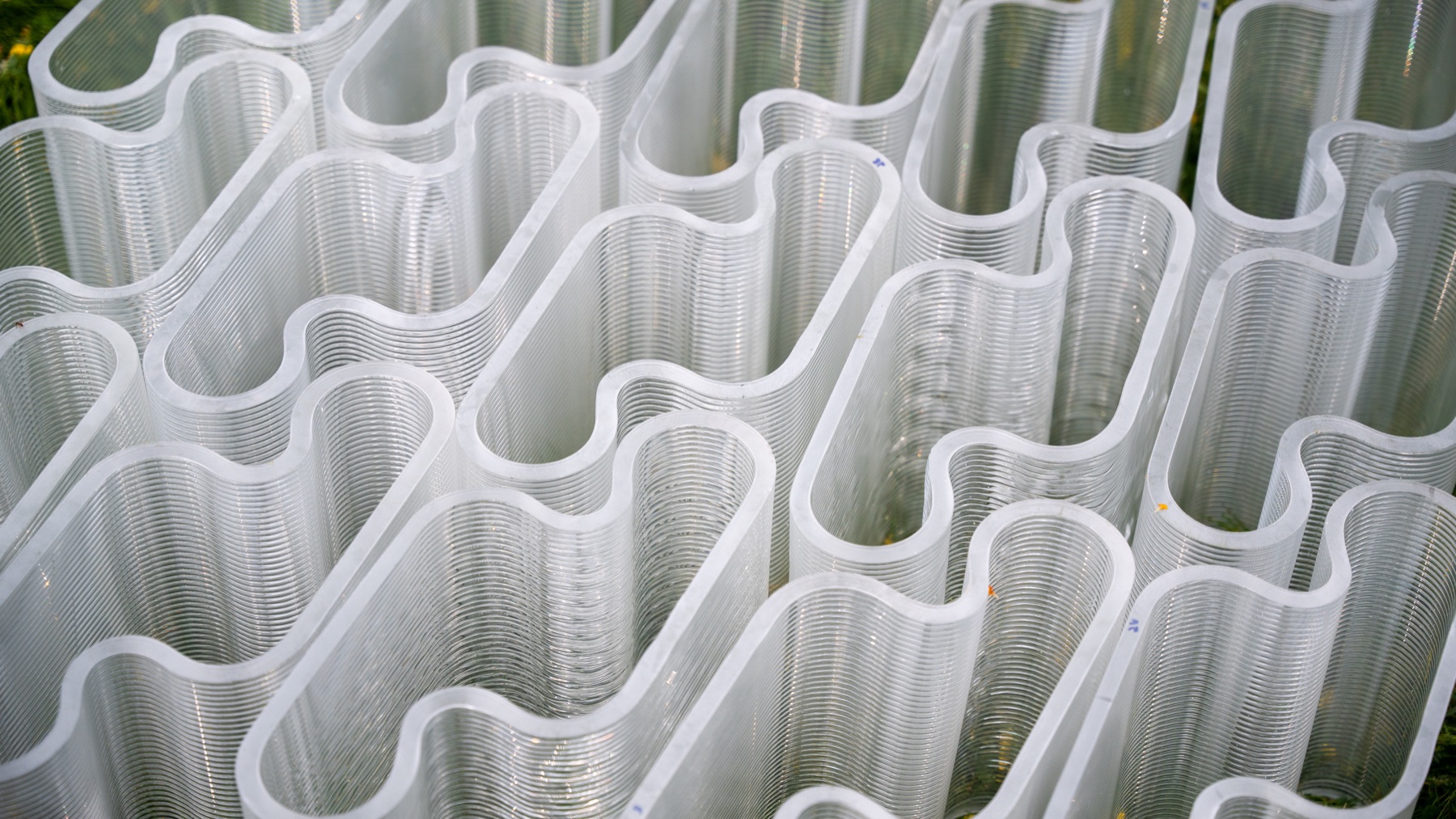 Rows of figure-eight interlocking glass masonry units showing the printed layer lines